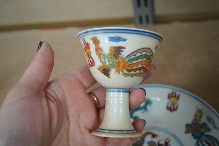 A pair of Chinese pedestal cups and three saucers. Condition - one cup severely damaged